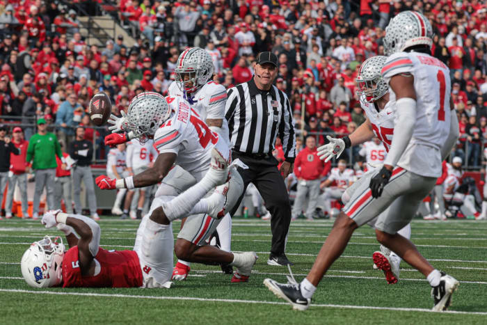 Ohio State Buckeyes safety Josh Proctor (41) breaks up a pass intended for Rutgers Scarlet Knights running back Kyle Monangai (5) as cornerback Jordan Hancock (7) intercepts the ball for a touchdown.